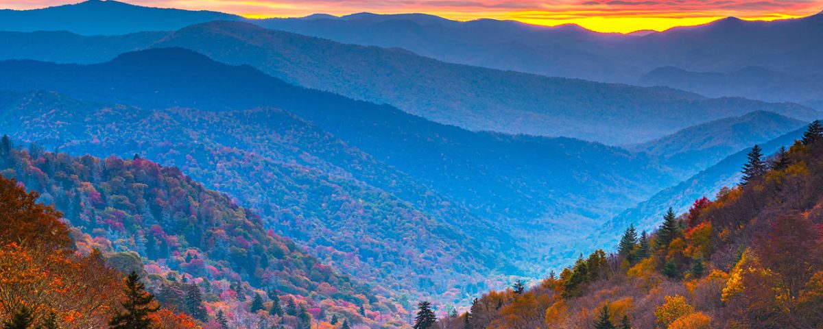 Family camping at Jellystone Park™ Cherokee with Smoky Mountain fall colors in September.